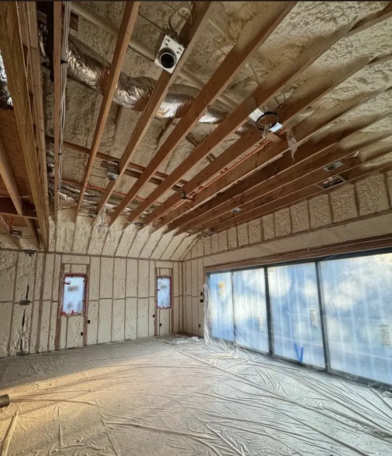 Interior walls and ceiling insulated with spray foam during new construction in Middlesex
